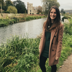 Emma beside a river.