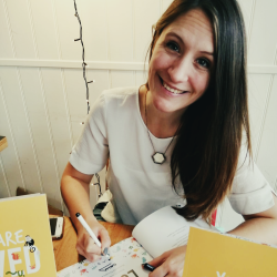 Emma Allen signing her books.